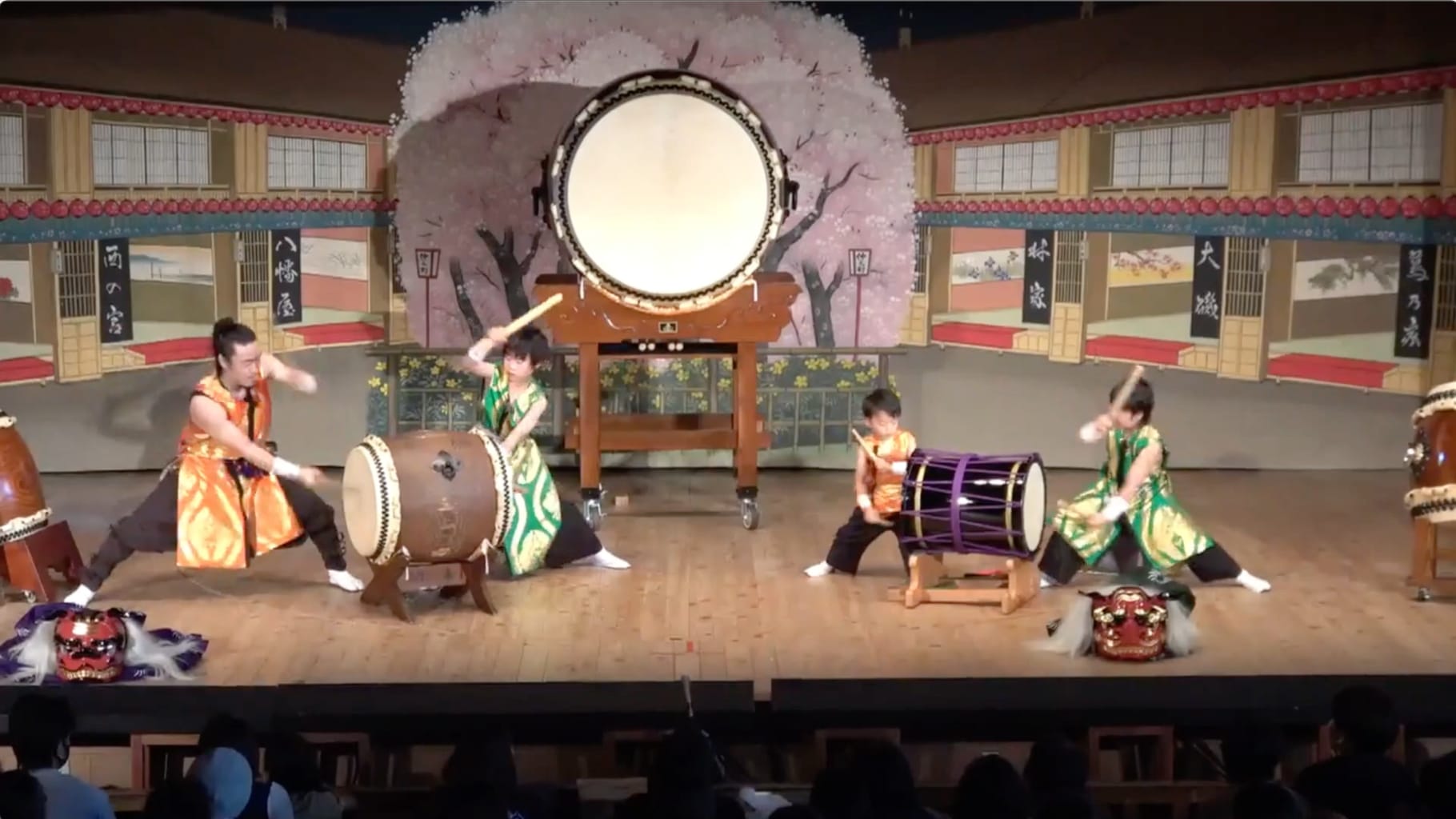 Takumi Kati and Peaceful Forest performing taiko drumming on stage